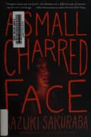 A small charred face