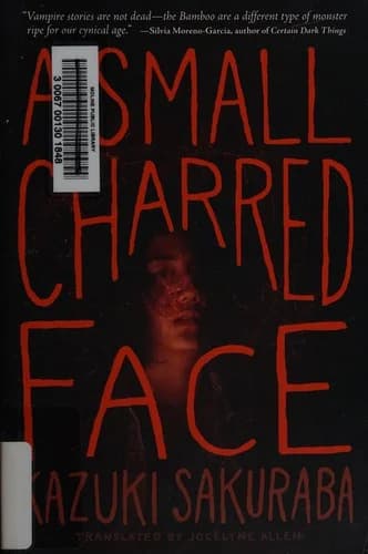 A small charred face